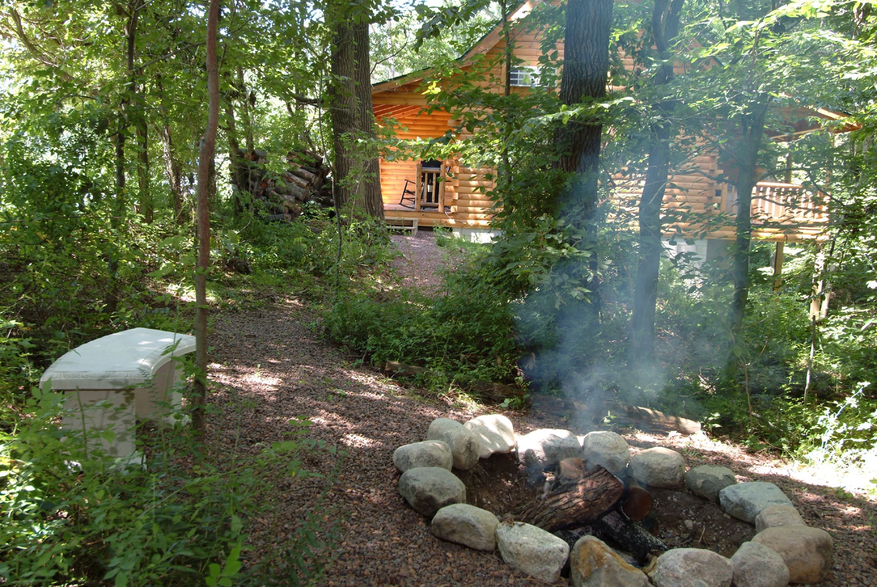 Fire ring in the woods at Cricket Hill Cabins