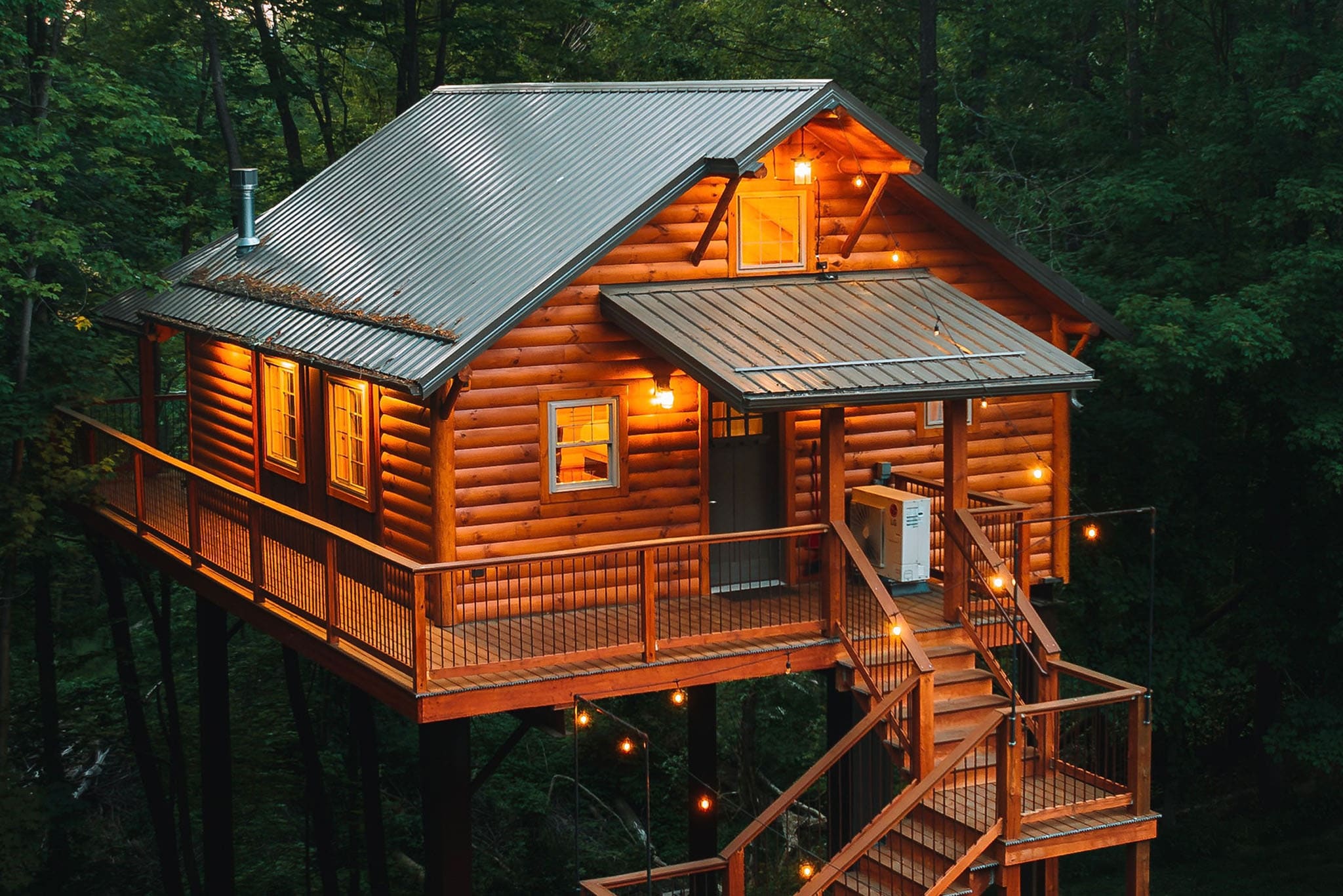 Exterior of Cricket Hill Treehouse B elevated among the trees