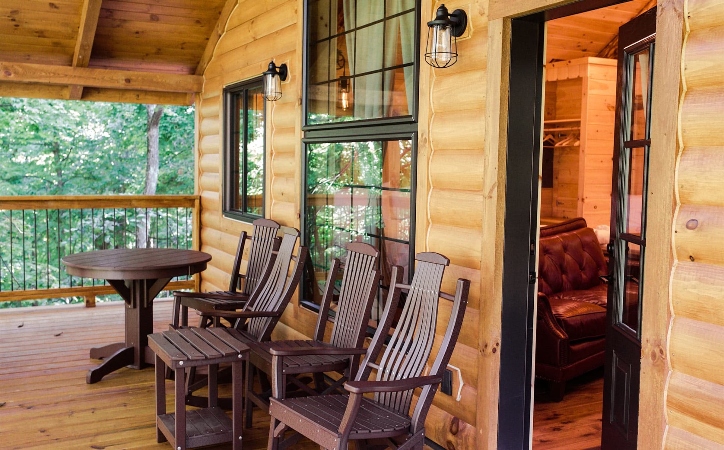 Wooded view from the covered deck of a Cricket Hill treehouse
