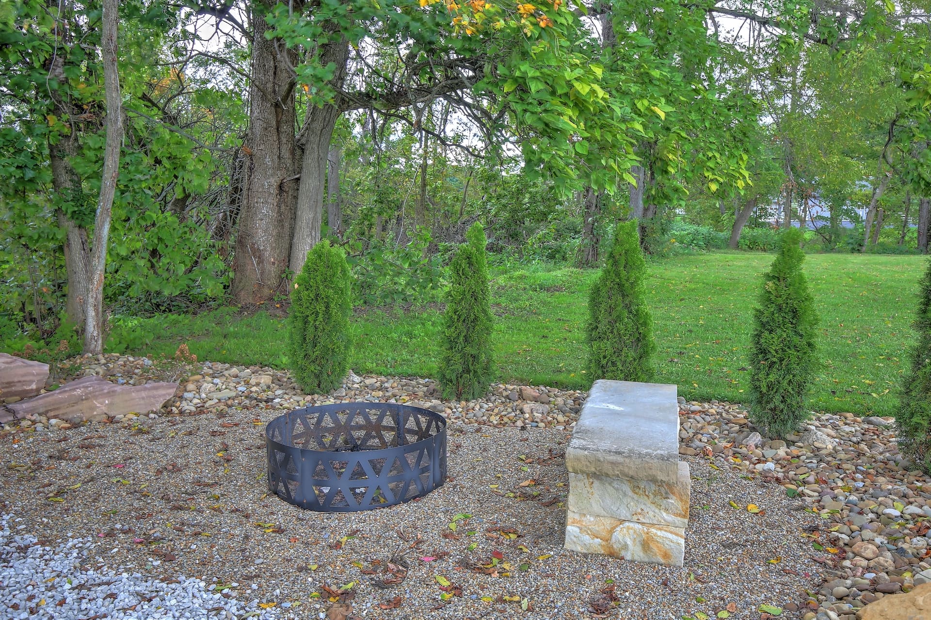 Evening fire pit beneath the trees at Cricket Hill